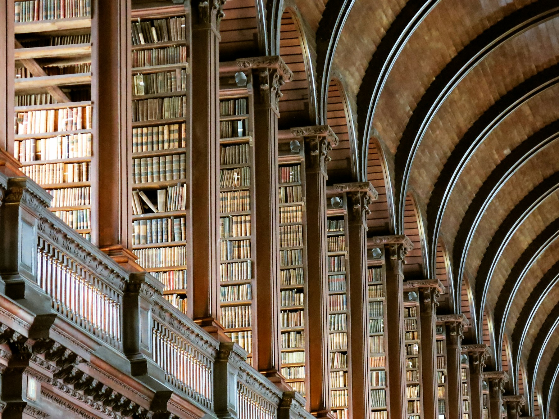 A library with wooden shelves and books